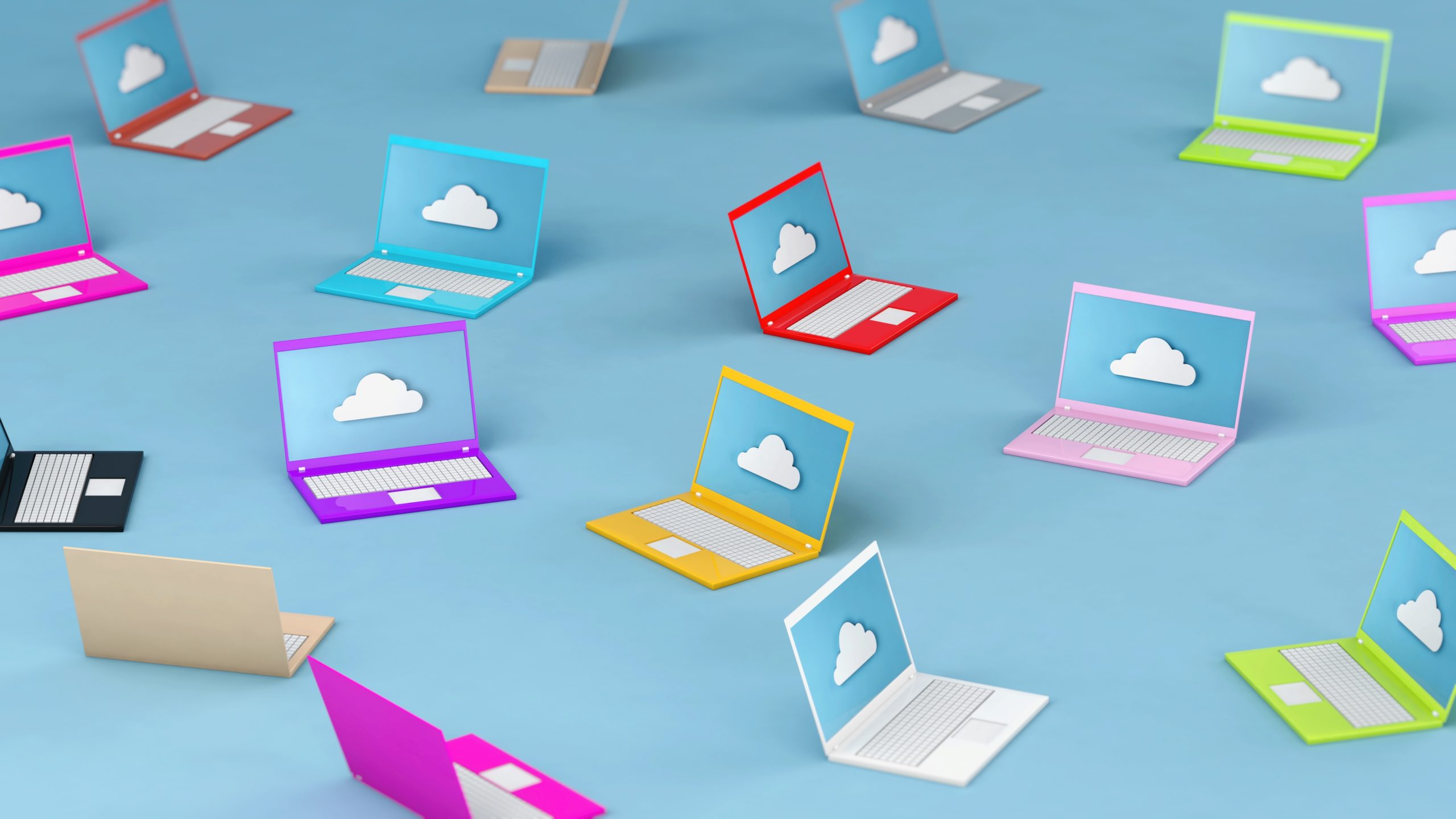 Die Illustration zeigt viele bunte Laptops mit jeweils einem Cloud-Symbol auf dem Bildschirm.